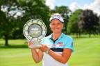 Participant with trophy at the Meijer LPGA Classic for Simply Give