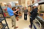 Executive Chairman Hank Meijer and LPGA Pros Kris Tamulis and Jaclyn Lee receiving tour of Simply Give food pantry partner