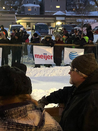 Attendees lining up to view sled dog races sponsored by Meijer in Marquette, Mich.