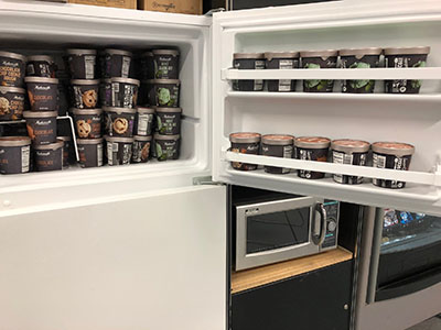 Freezer full of ice cream pints donated by Hudsonville Ice Cream to Meijer team members