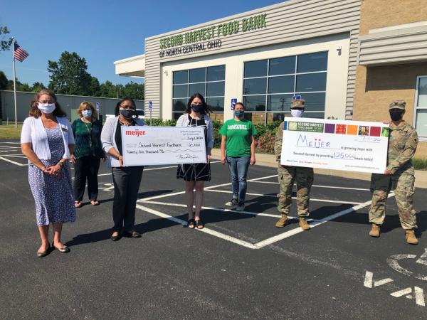 Lorain, Ohio Meijer Store Director Cassandra Robinson presenting $25,000 check donation to Second Harvest Food Bank