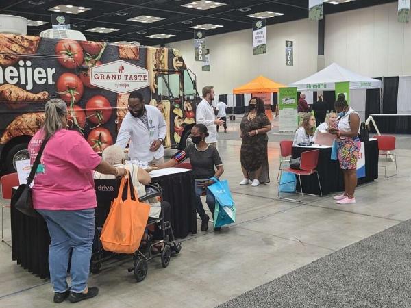 Meijer pharmacists administering health screenings at a Black and Minority Health Fair in Indianapolis