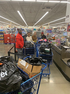 Volunteers and Meijer team members shop for toys for Louisville children.