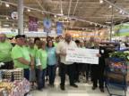 Oshtemo Meijer presenting Simply Give partner Friday Groceries with a $59,800 check