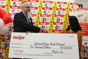 Lynette Ackley, Meijer Vice President of Drugstore and Baby, presents National Diaper Bank Network with $10,000 check