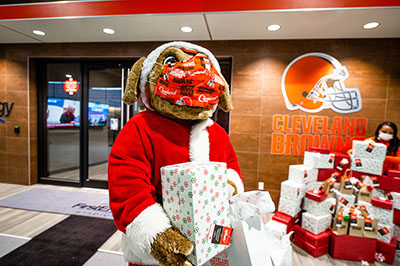 Cleveland Browns mascot Chomps delivering gifts to local children in need for 
