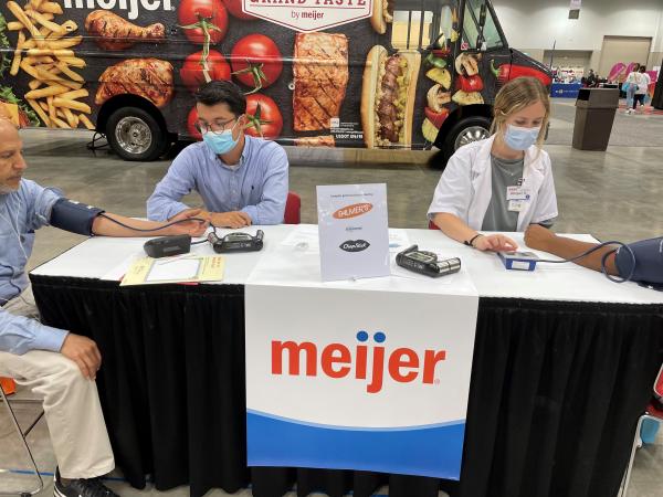 Meijer pharmacists administering health screenings at a Black and Minority Health Fair in Indianapolis