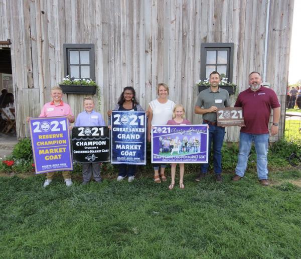 Market goat grand champions with awards at the 2021 Michigan Livestock Expo