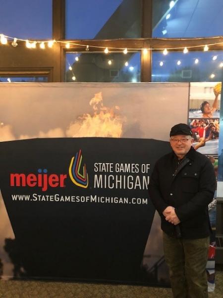 Marquette Store Director John Spaulding at 2022 opening ceremonies of the winter Meijer State Games in Marquette, Mich.