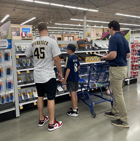 Milwaukee Brewers player Brad Boxberger shops for school supplies with a local student at the Greenfield, Wisconsin Meijer
