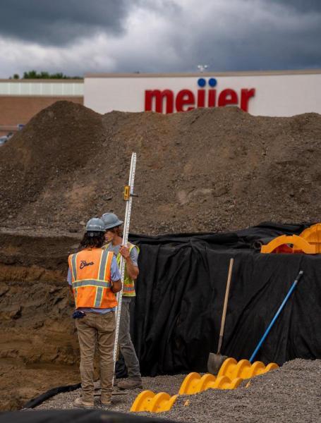 Construction workers install infiltration structures beneath the Traverse City, Mich. Meijer parking lot.