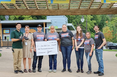Meijer team members from the Walker, Mich. distribution center present representatives from the John Ball Zoo with a check for $1,664.