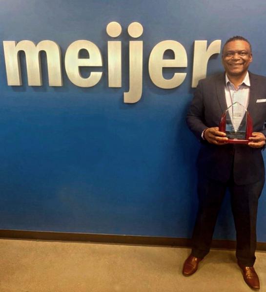 Fredrick Walker, Director of the Meijer Lansing Distribution Center, accepts the United Way Partner of the Year Award on behalf of Meijer.