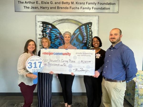 Meijer store team presents check to Stewart’s Caring Place