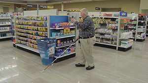 Casey Dutmer, a blind Meijer customer, uses the Aira app to navigate a Meijer store.